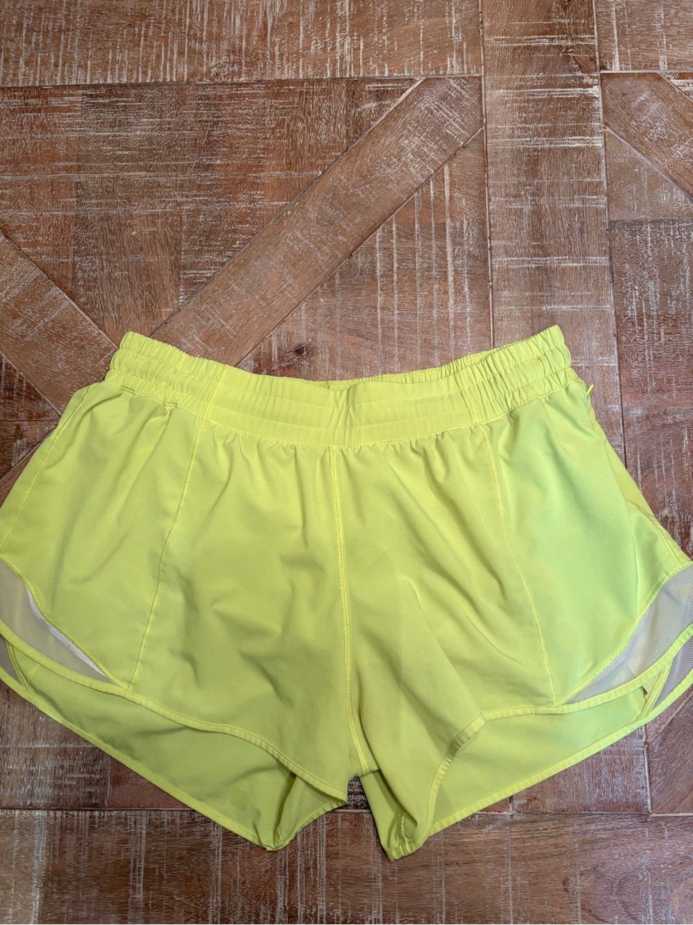 Lululemon Hotty Hot low rise shorts, bright neon yellow
Size 12 Great condition